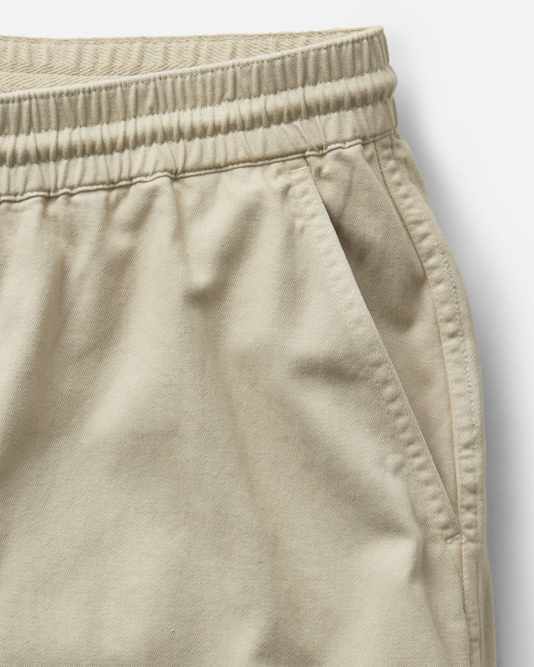 Close-up of Taylor Stitch The Après Short in Organic Aged Stone Foundation Twill with drawstring on a white background