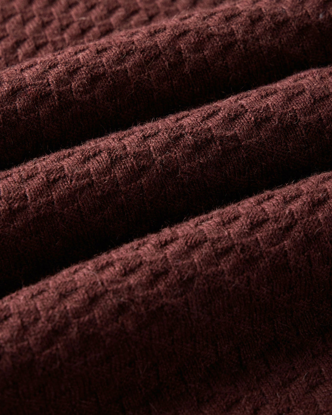 Close-up of The Arlo Sweater Polo
in Burgundy Texture Knit textured fabric