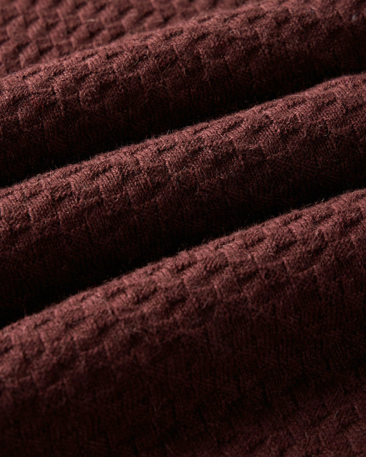 Close-up of The Arlo Sweater Polo
in Burgundy Texture Knit textured fabric