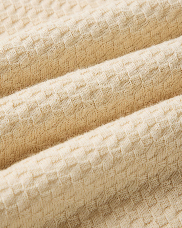Close-up of beige textured fabric