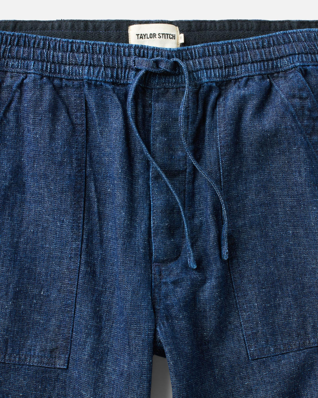 Close up of Taylor Stitch Breakwater pants drawstring waist.