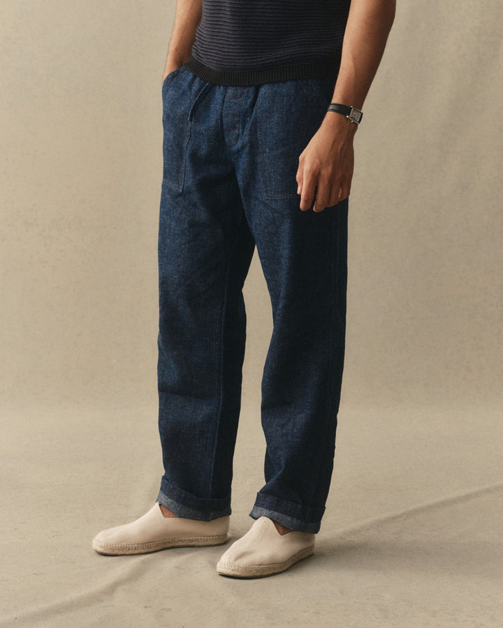 Man wearing Taylor Stitch Breakwater pants against a neutral background.