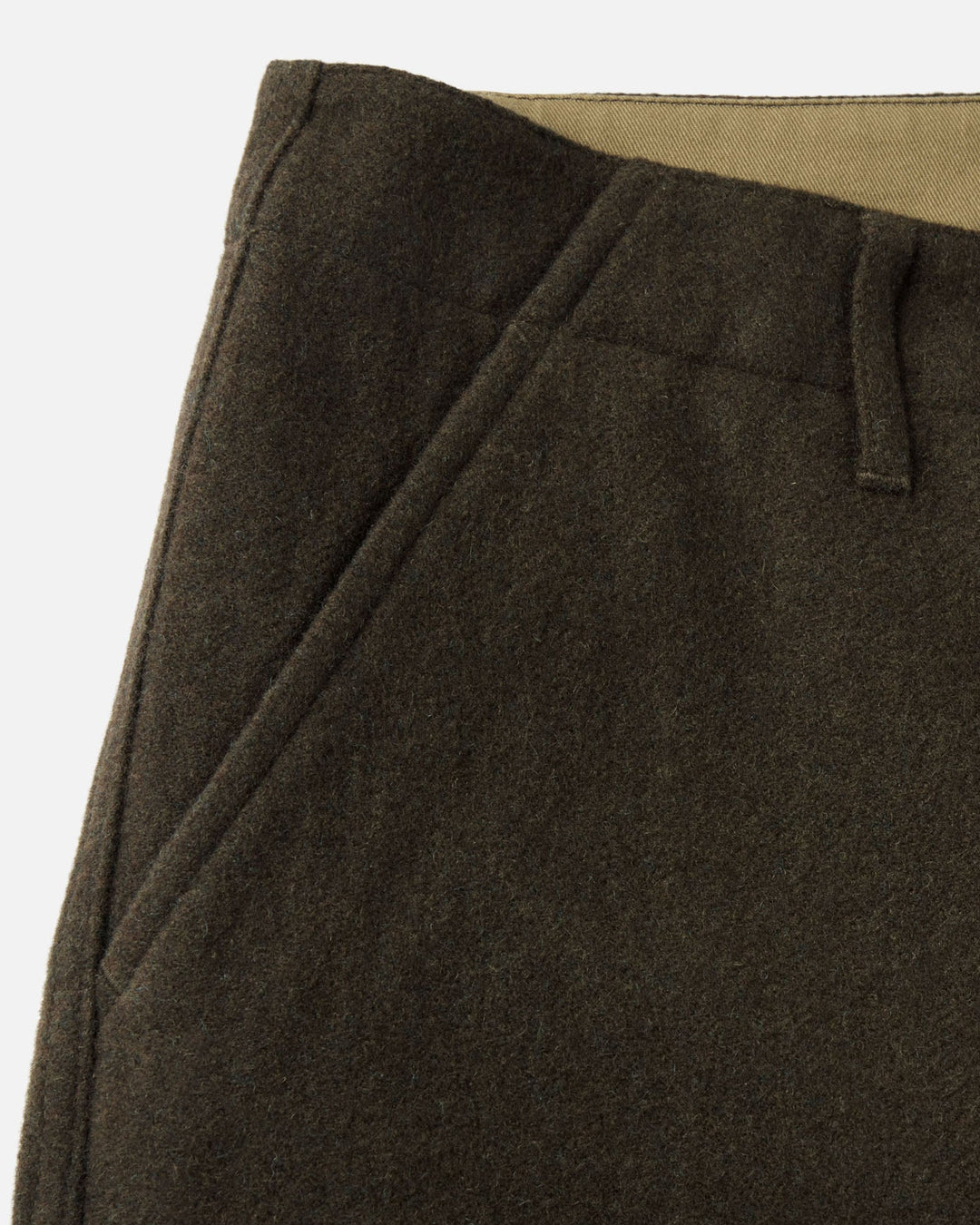 Close up of the front of the carnegie pants, showing left pocket and belt loop.