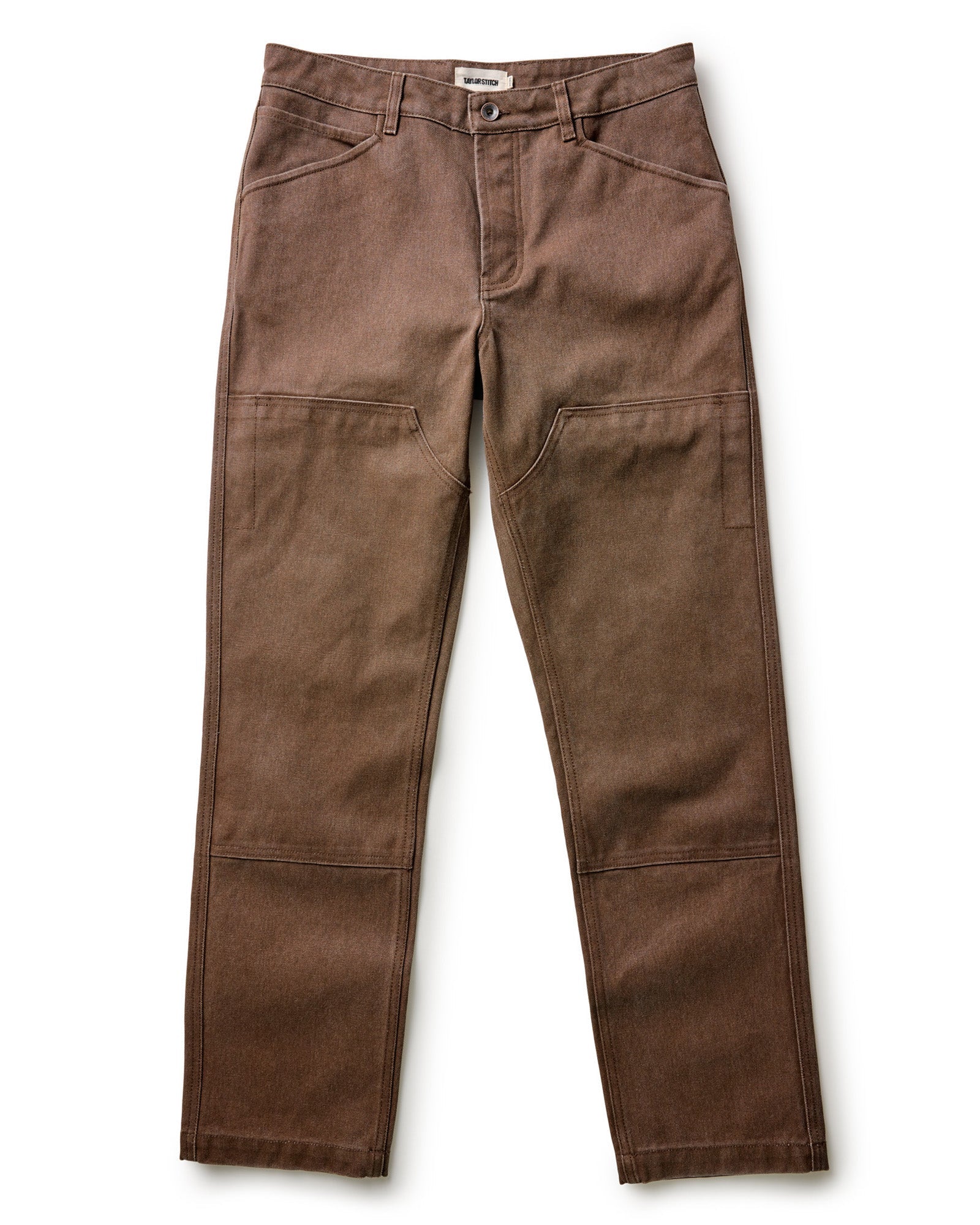 Taylor Stitch's Chore Pant in Aged Penny Chipped Canvas on a white background