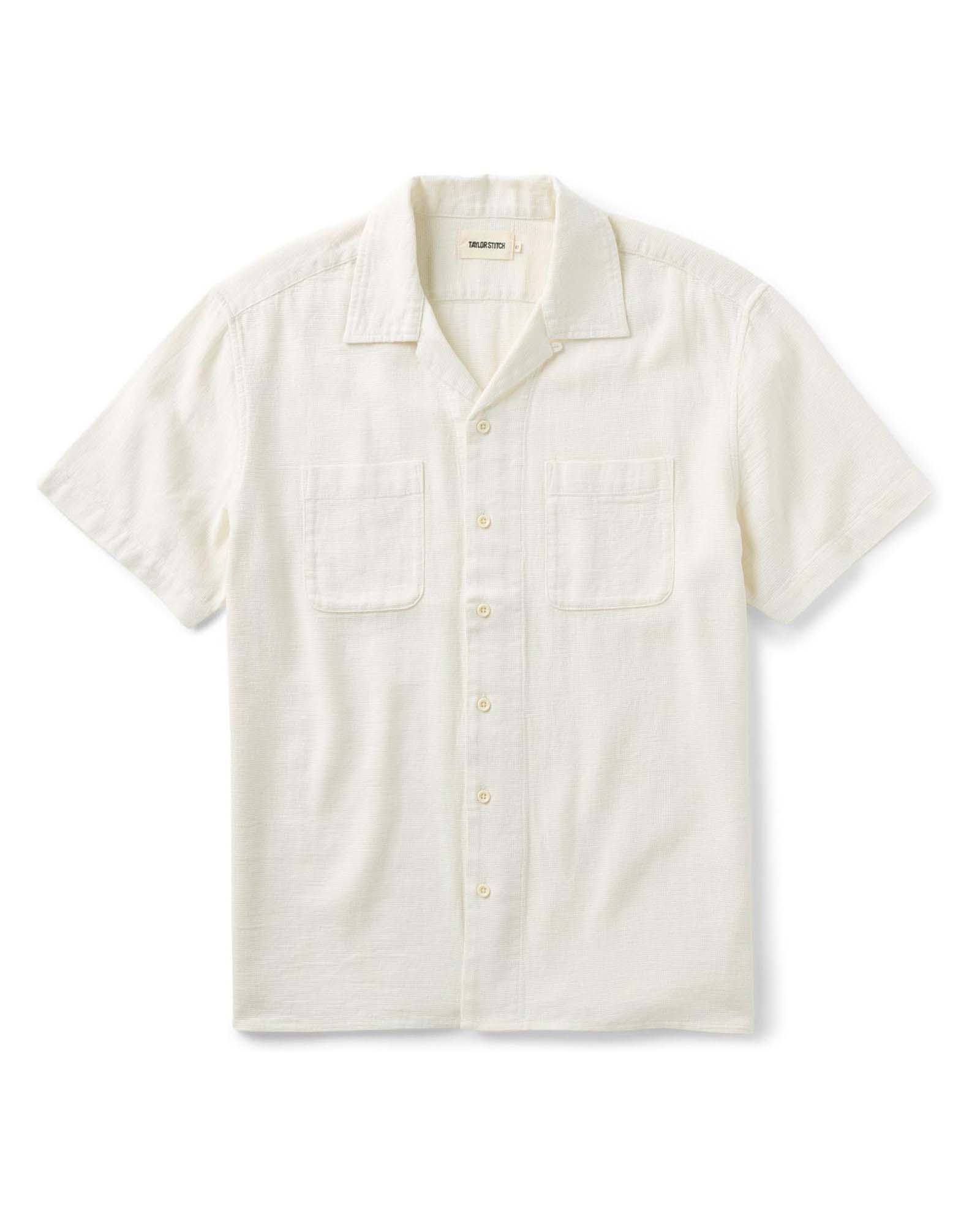 The Conrad Shirt
in Vintage White Linen with button details on a white background