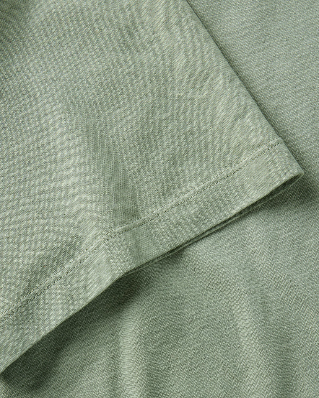 Close-up of The Cotton Hemp Polo in Sage by Taylor Stitch.