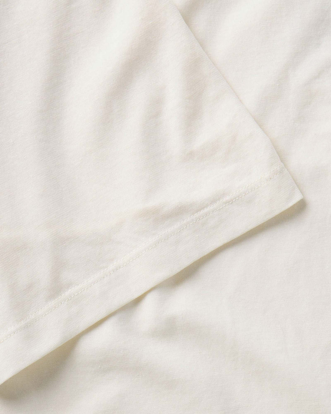 Close up of The Cotton Hemp Polo in Vintage White by Taylor Stitch.