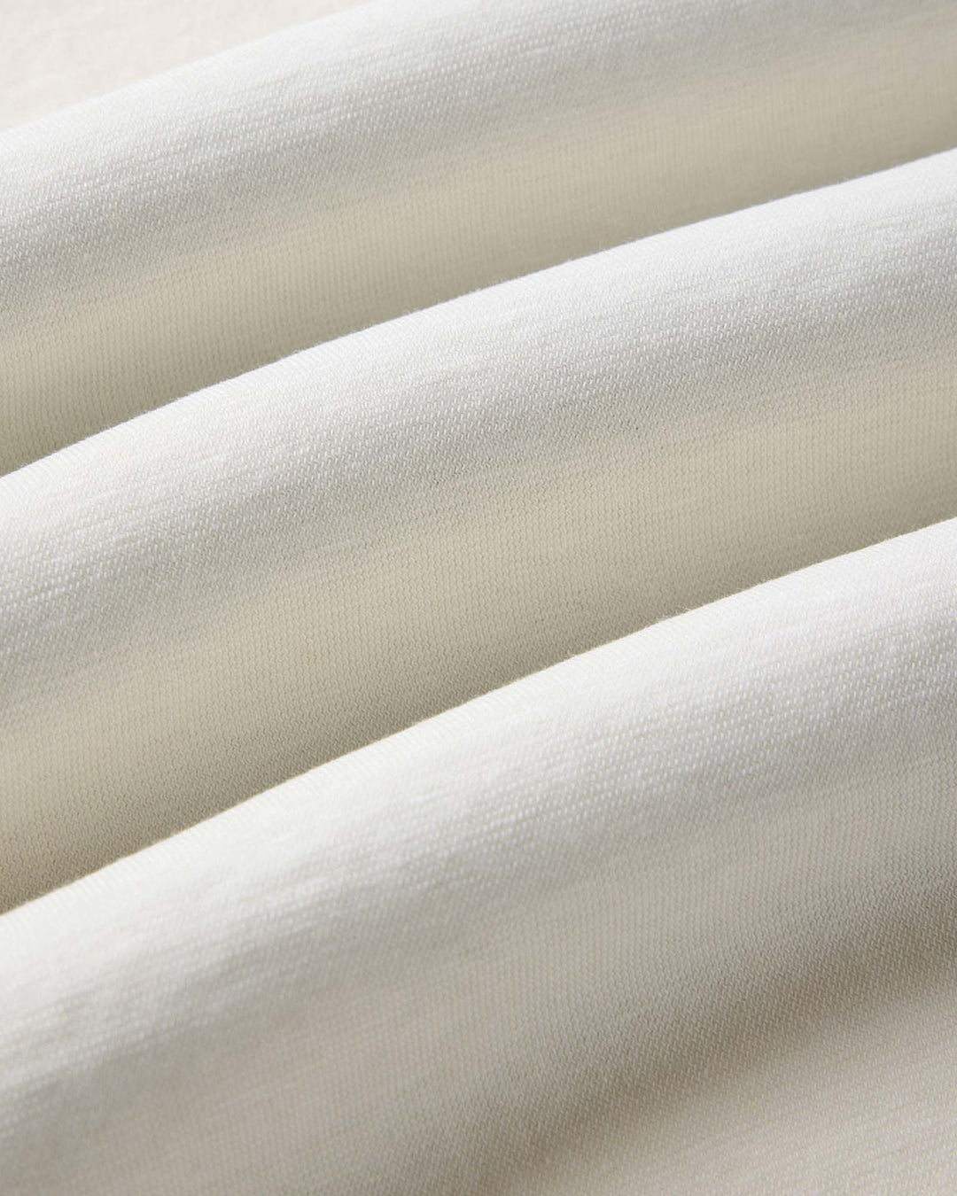 Close-up of The Cotton Hemp Polo in Vintage White by Taylor Stitch.