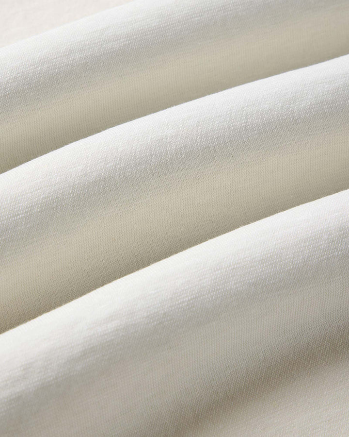Close-up of The Cotton Hemp Polo in Vintage White by Taylor Stitch.