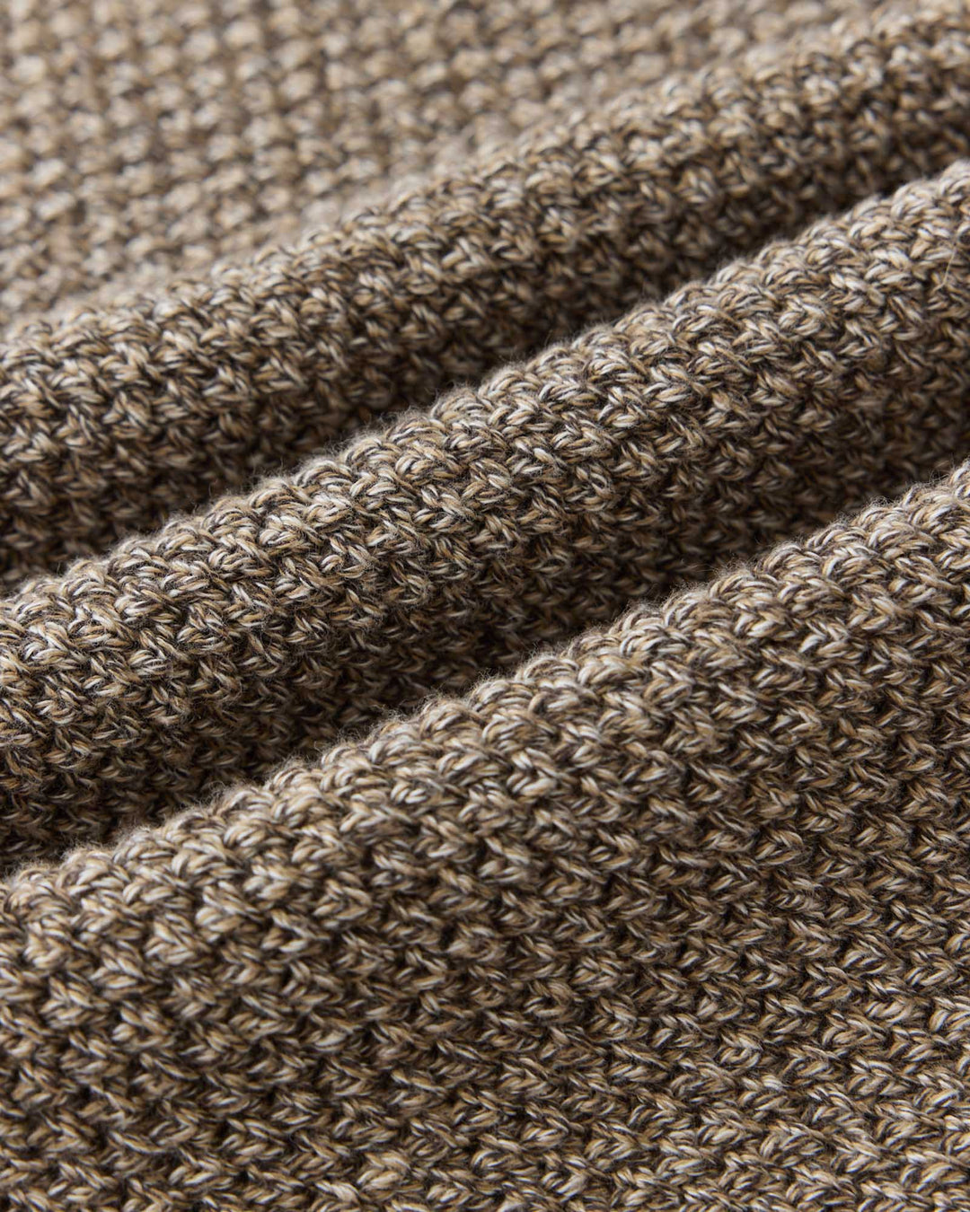 Close-up of the Crawford Crew Sweater in coffee Twist, showing the detailed texture of the yarn and stitching.
