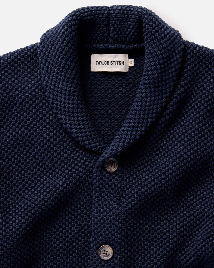 The Crawford Sweater in Navy with buttons on a white background