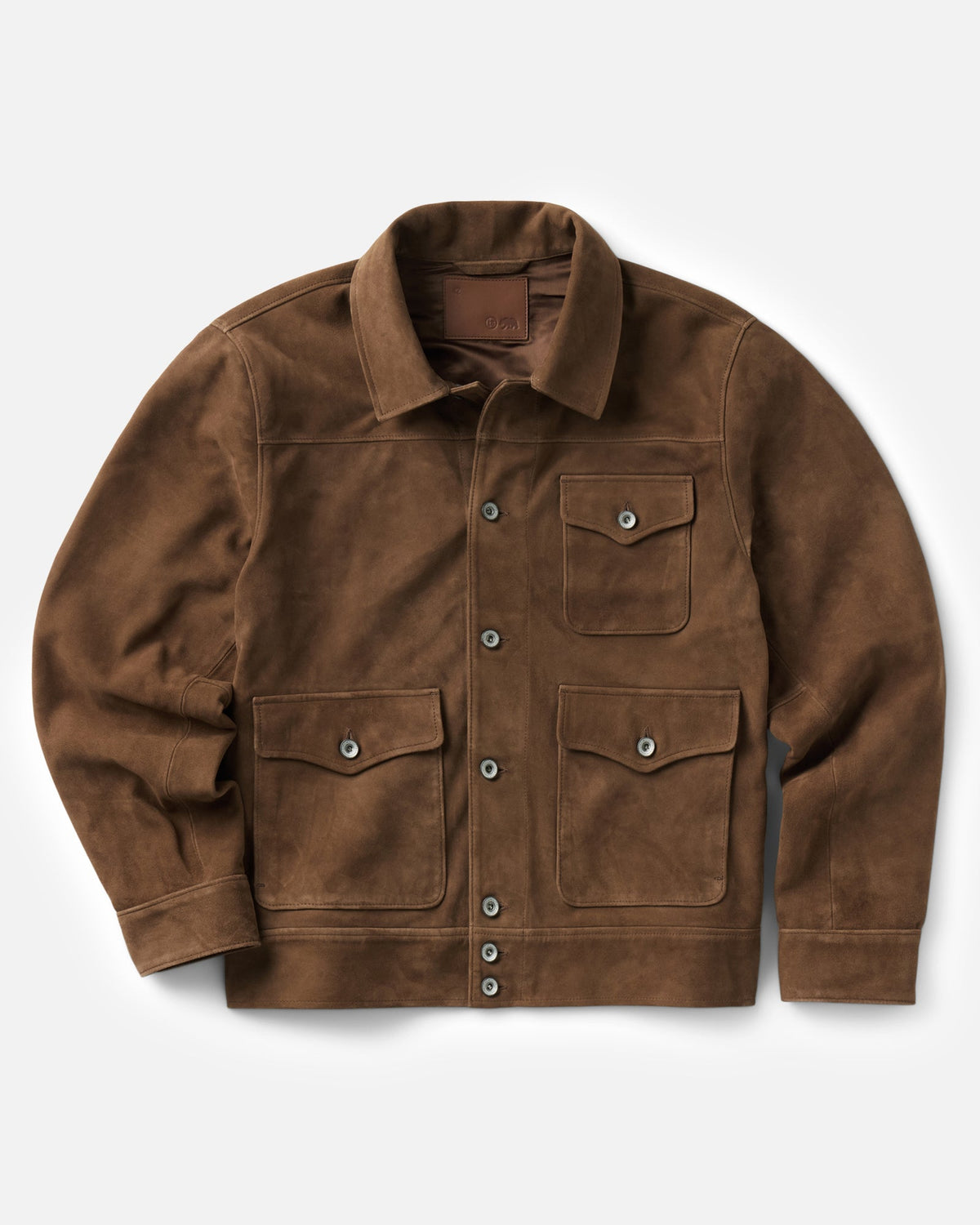 A brown suede jacket with a pointed collar, button front, and three front flap pockets, shown flat on a light gray background.
