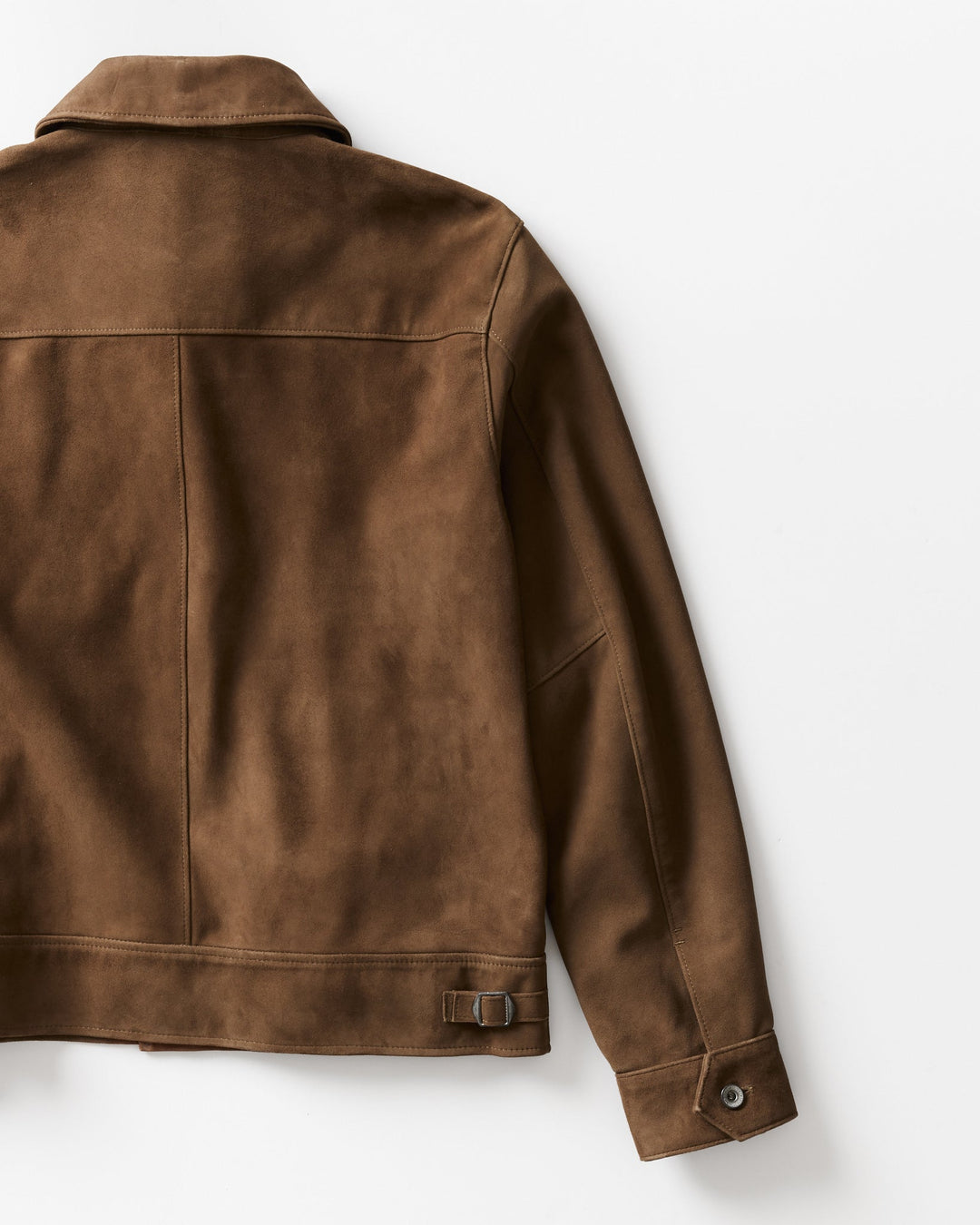 A close-up of the back of a brown suede or suede-like jacket on a clean white background.