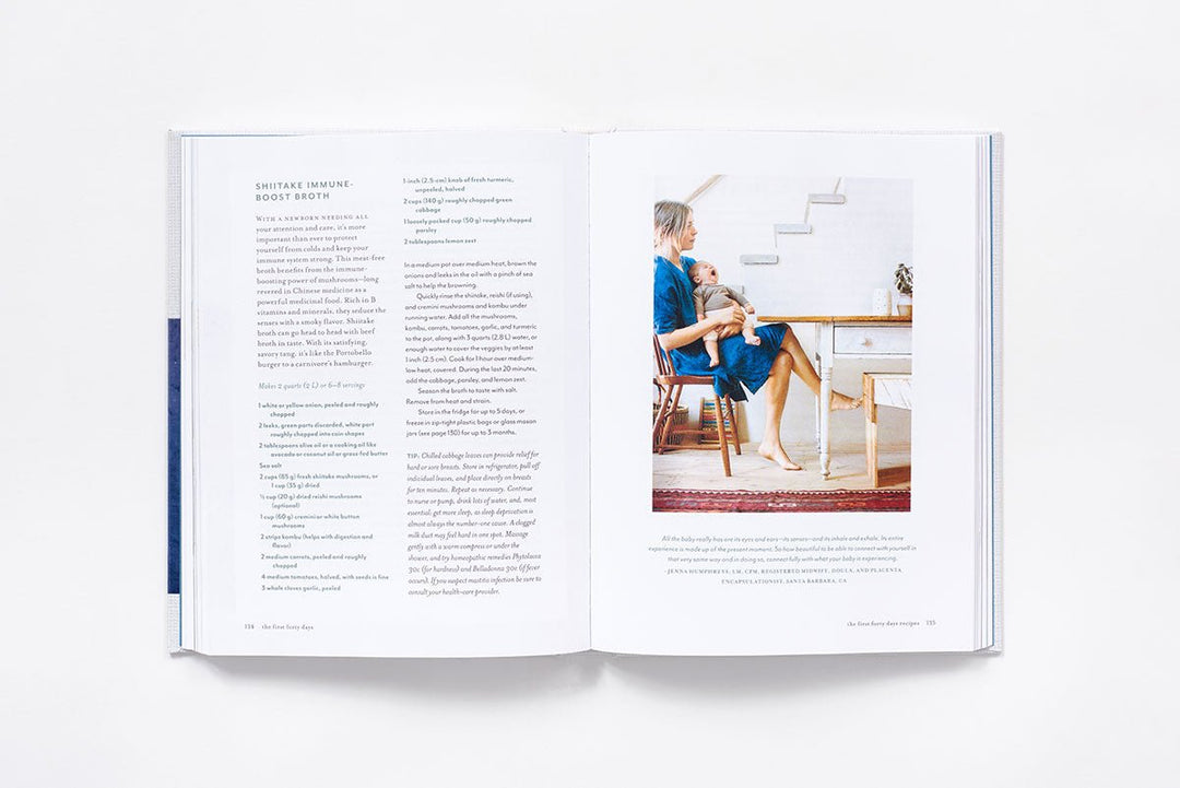 Open book with text and a photo of a woman holding a baby on a white background