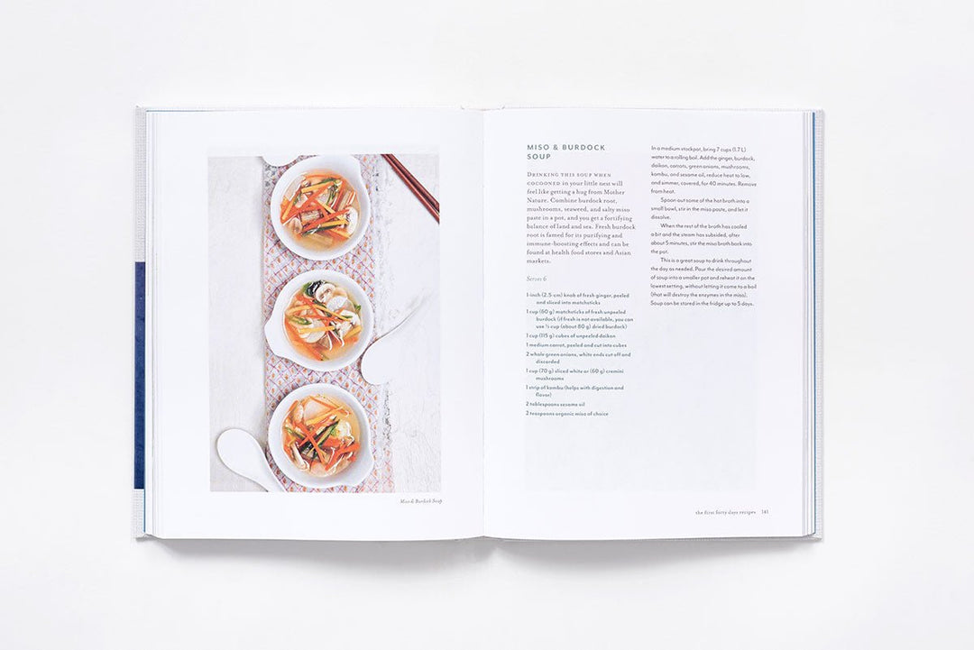 Open book showing a recipe with images of food on a white background