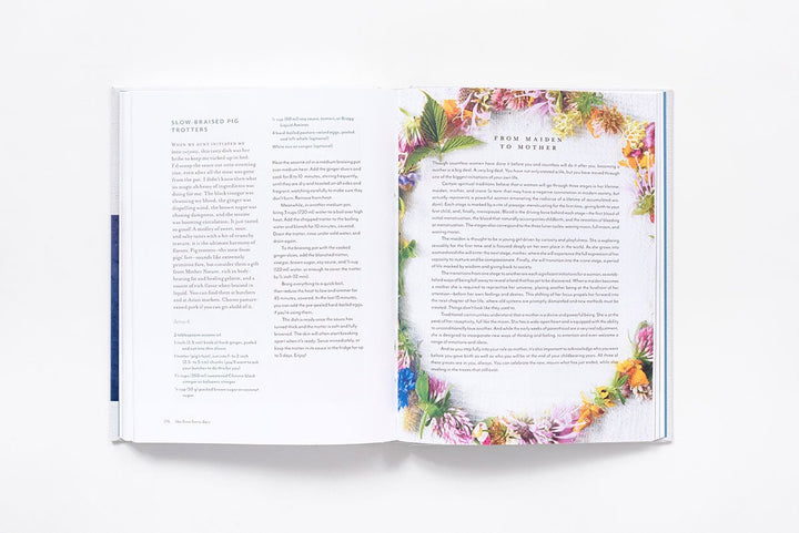 Open book with floral design on a white background