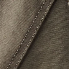 Close-up of a dark olive fabric with a diagonal stitched seam.