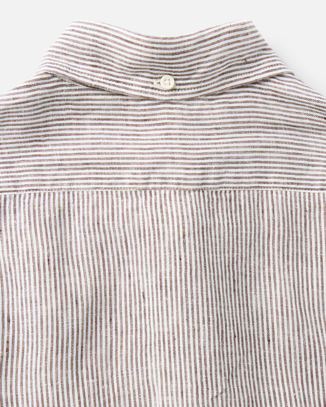 Close-up of a Burgundy University Stripe Linen shirt with a collar on a light gray background