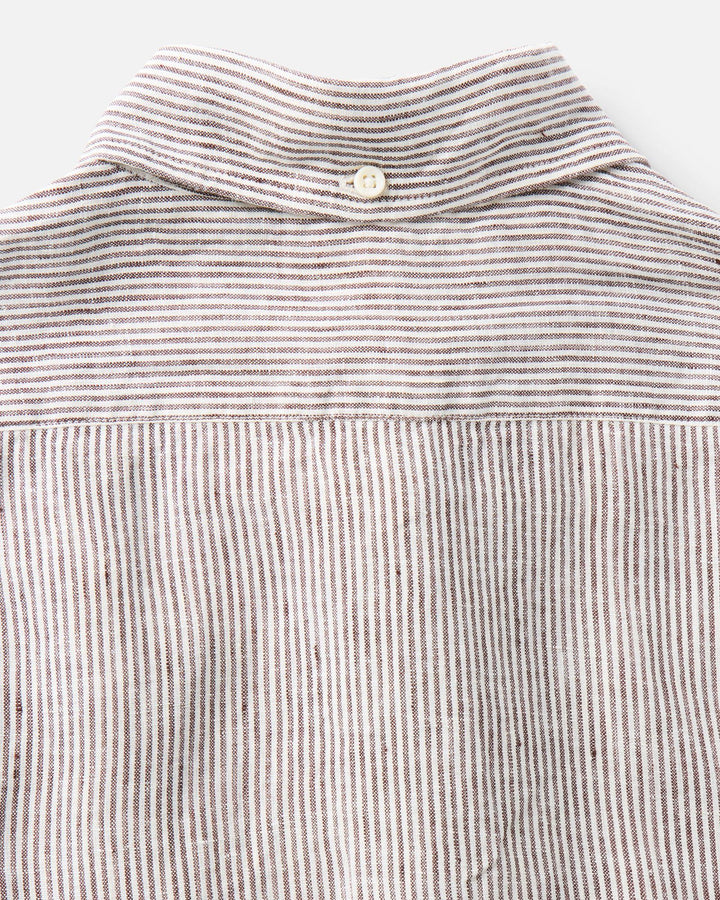 Close-up of a Burgundy University Stripe Linen shirt with a collar on a light gray background