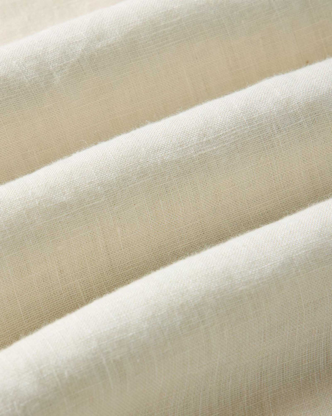 Close-up of vintage white fabric with a soft texture