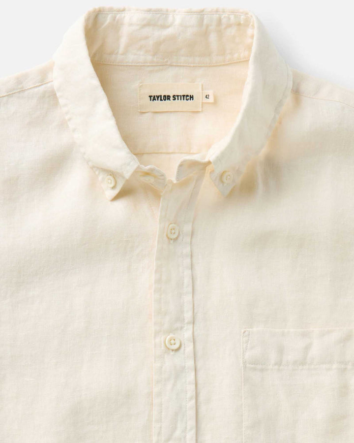 Close-up of a vintage white-colored shirt with &