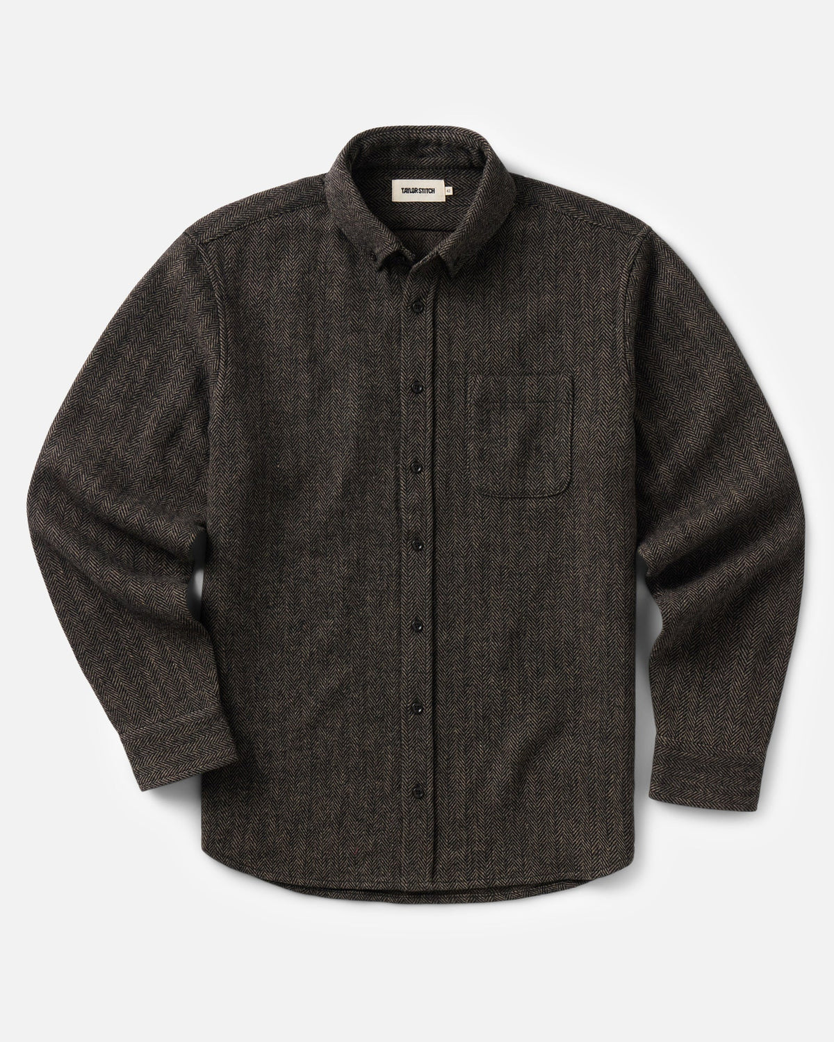A dark brown textured long-sleeve button-up shirt with a chest pocket, displayed flat against a light gray background.