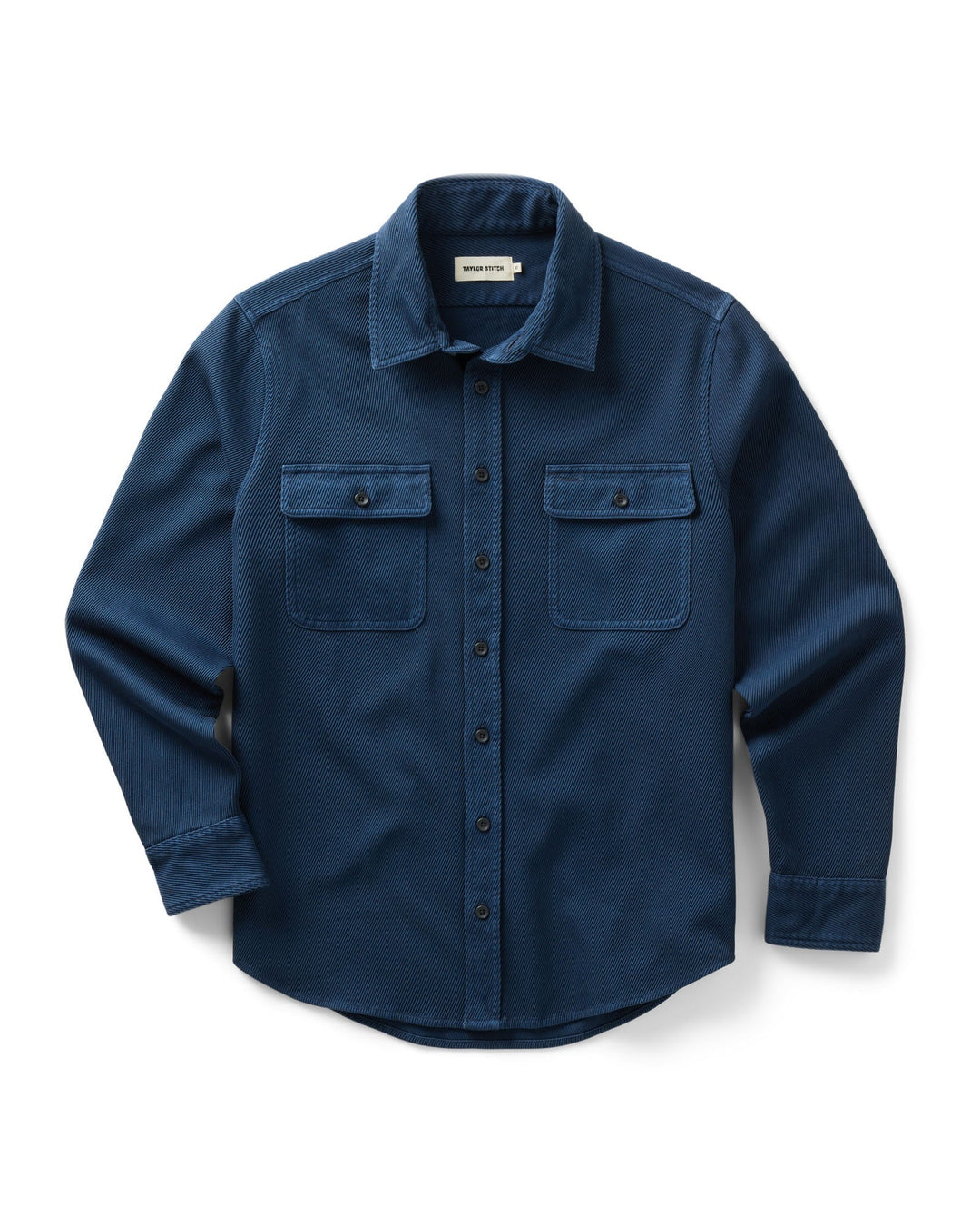 A dark blue long-sleeve button-up shirt with two buttoned chest pockets, displayed flat against a white background.