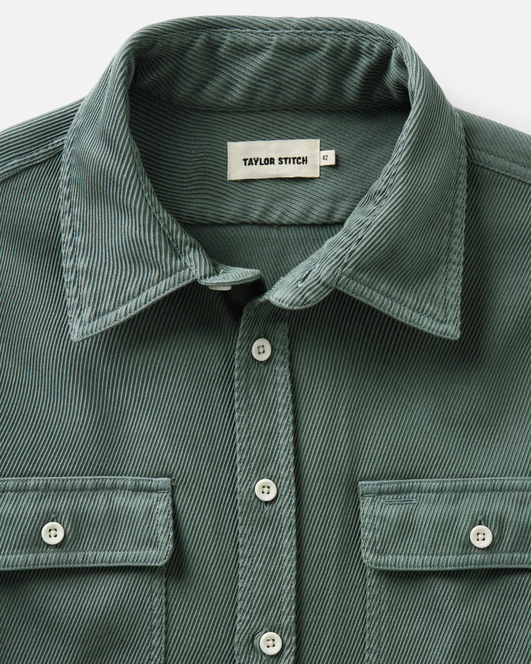 Close-up of a deep sea ledge button-up shirt by Taylor Stitch, showing the collar, front buttons, and chest pockets.