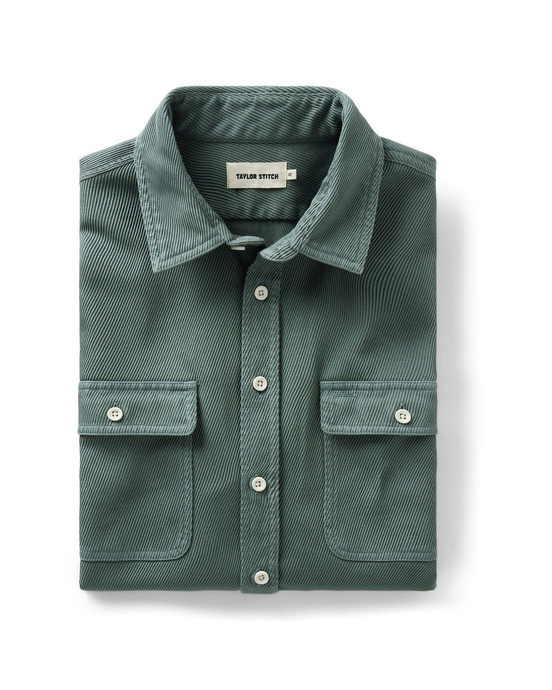 A folded ledge deep sea button-up shirt with two chest pockets, displayed on a clean white background.