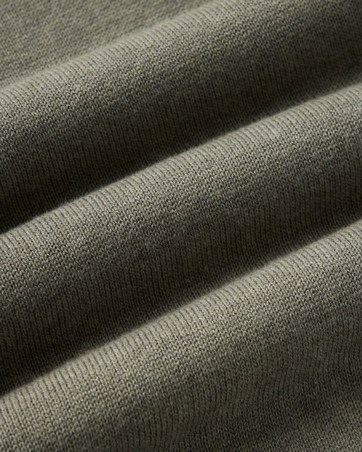 Close up of the valencia sweater fabric in olive cotton cashmere.