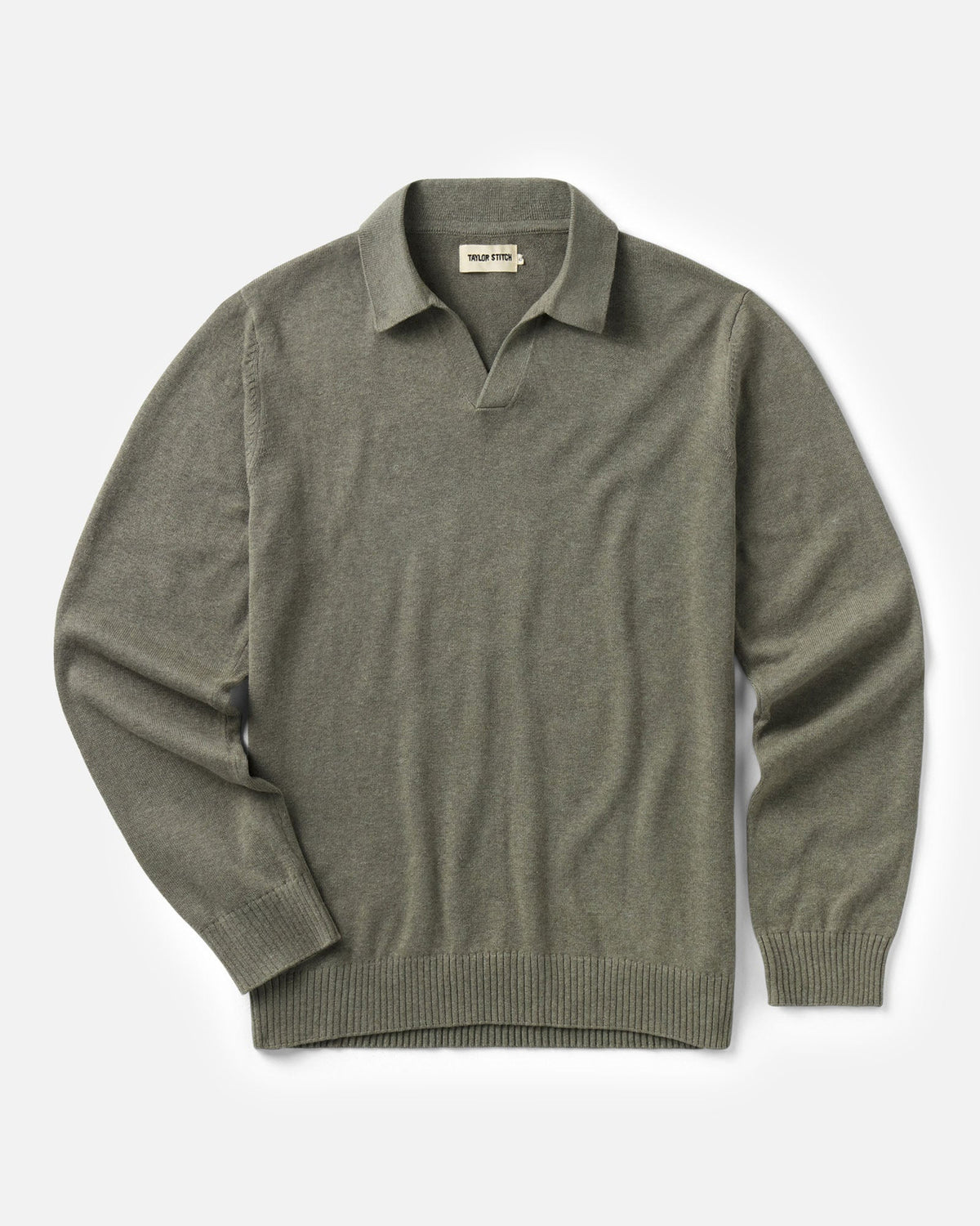 Flat lay of the Long Sleeve Valencia Sweater Polo in live Cotton Cashmere on a white background. 