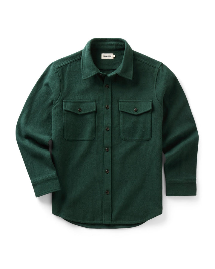 A dark forest green long-sleeve button-up maritime shirt jacket with two chest flap pockets, displayed flat against a clean white background.