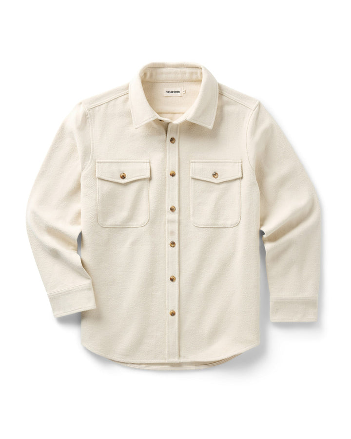 A vintage-white long-sleeve button-up maritime shirt jacket with two buttoned chest pockets, displayed flat against a white background.