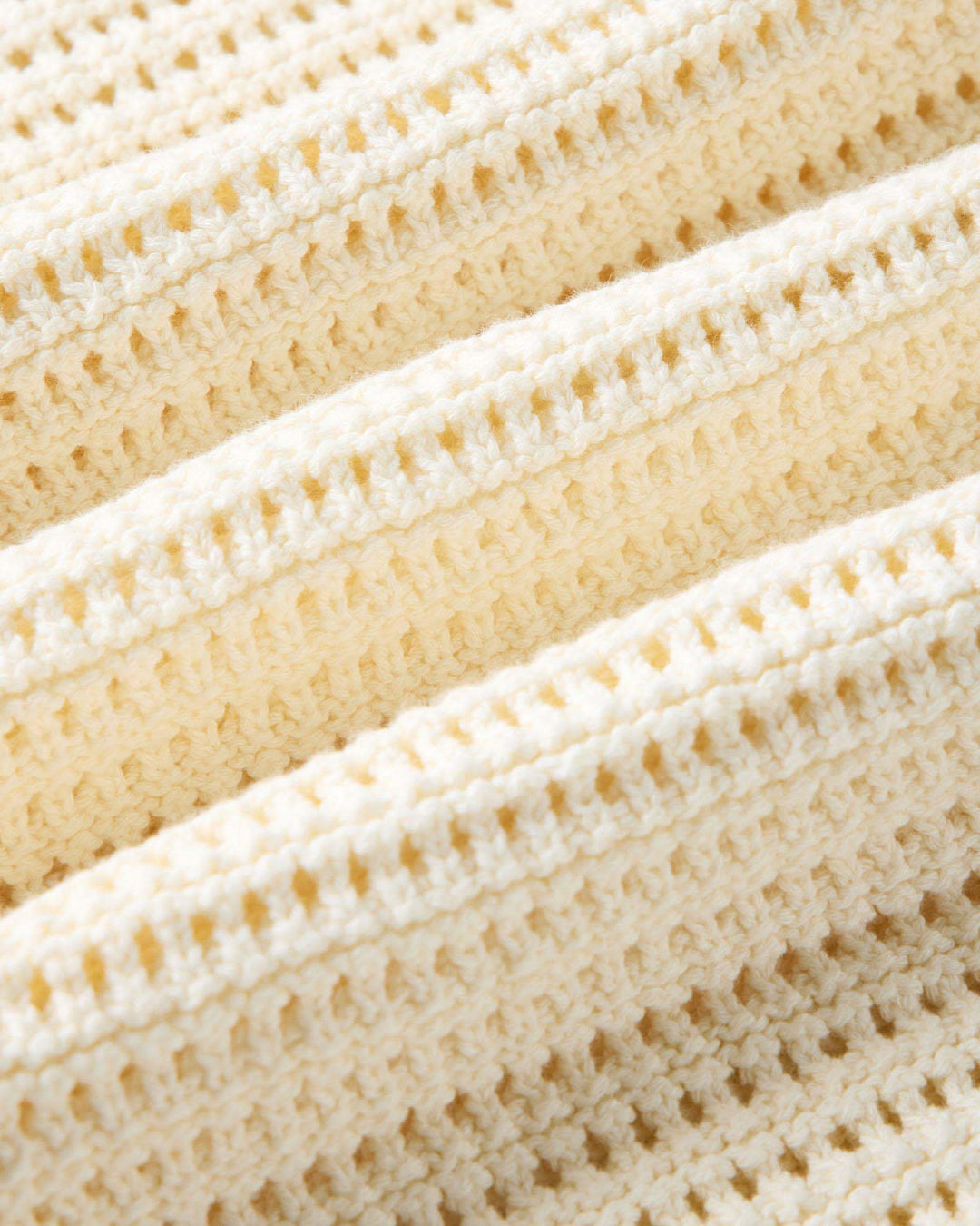 Close-up of The Monterey Sweater Polo in Vintage White Crochet