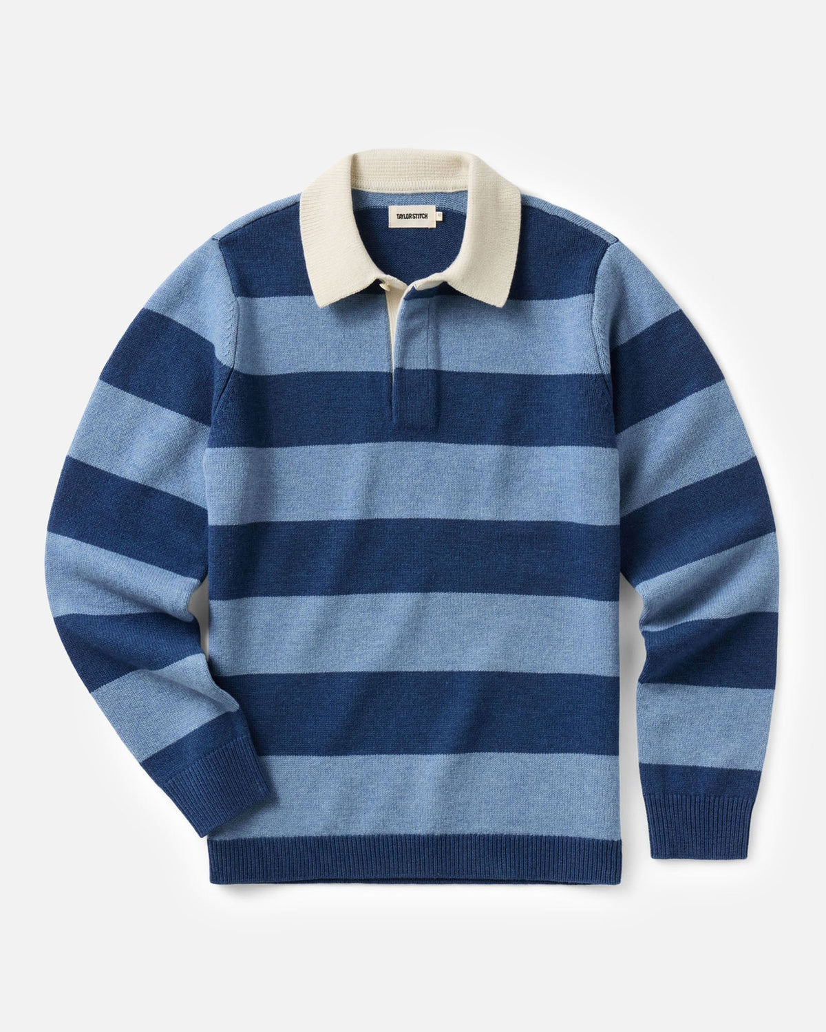 A long-sleeve knit rugby-style sweater with horizontal stripes in navy and light blue, featuring a contrasting cream collar and a short button placket.