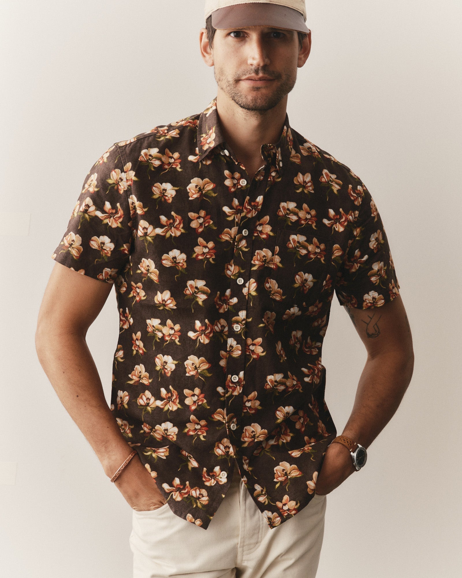 Man wearing The Short Sleeve Jack
in Magnolia and cap against a plain background