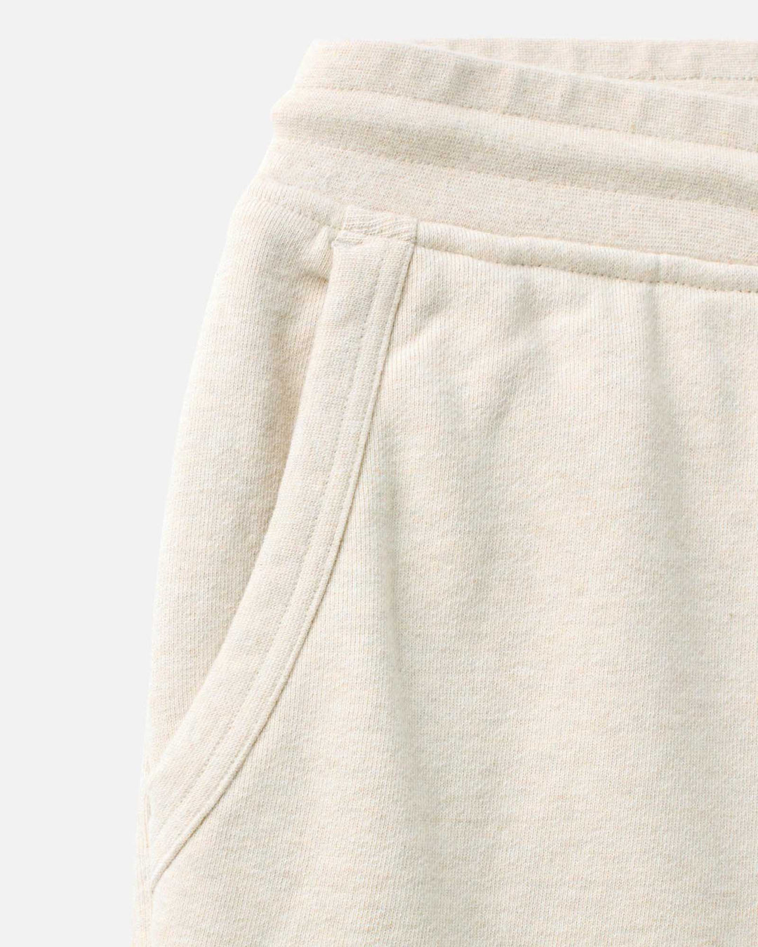 Close-up of The Sunset Short
in Heather Oat Terry on a light gray background