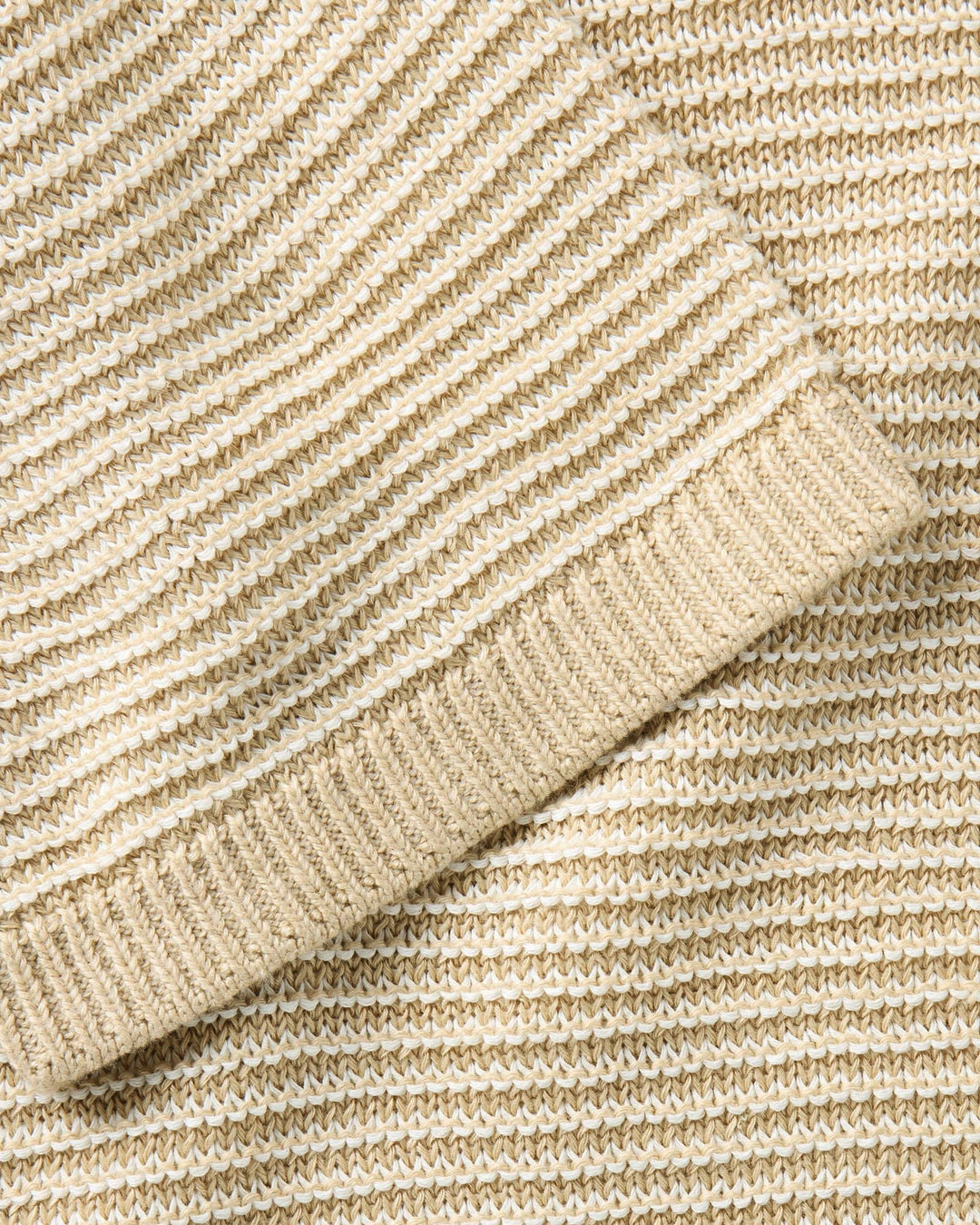 Close-up of The Valencia Sweater Polo
in Sand Stripe fabric texture