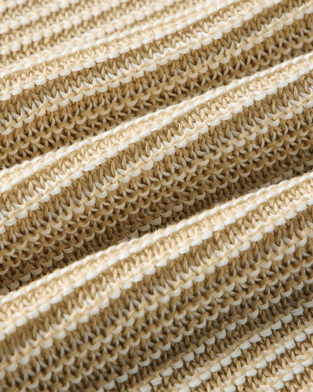 Close-up of The Valencia Sweater Polo
in Sand Stripefabric texture
