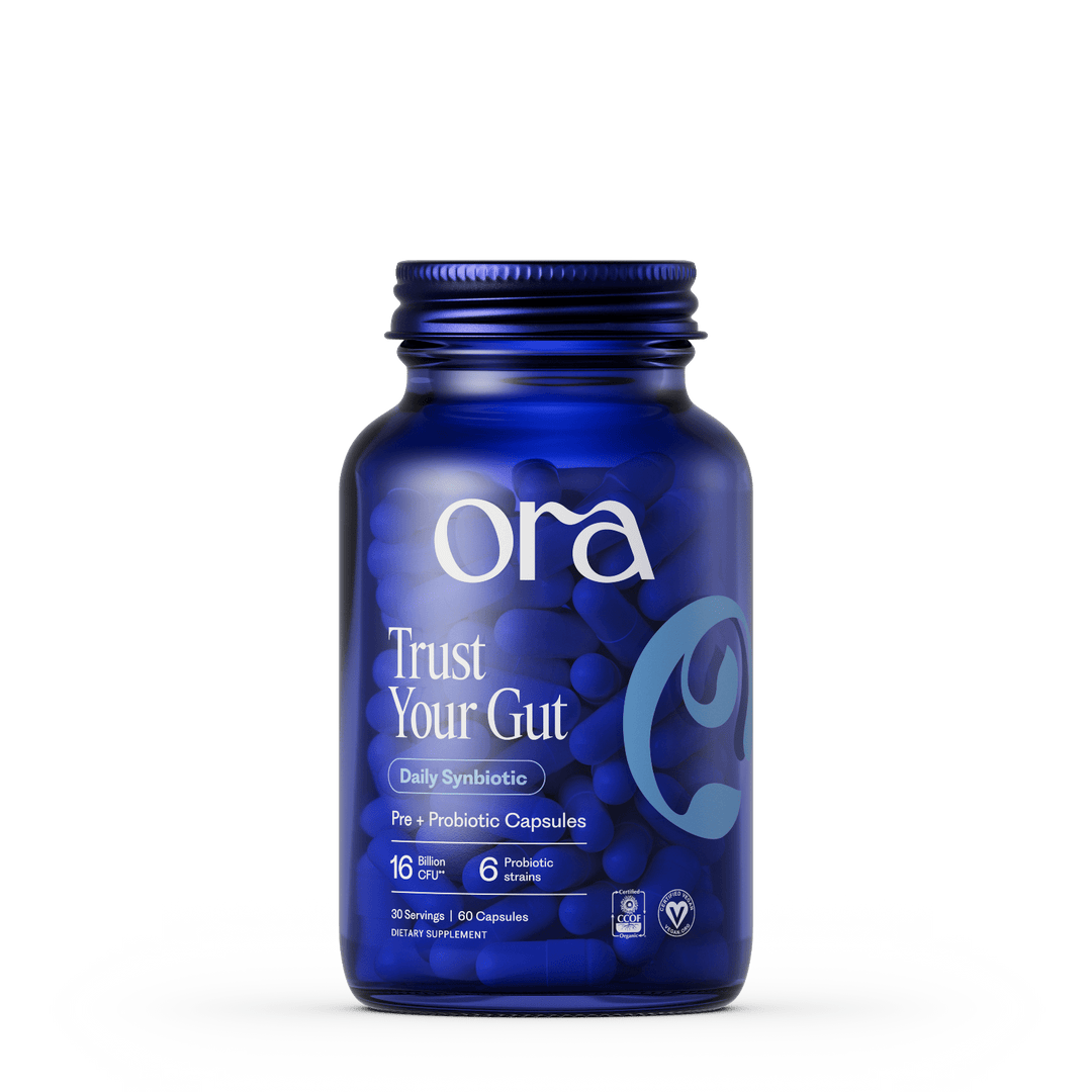 Blue bottle of Ora Trust Your Gut supplement on a white background