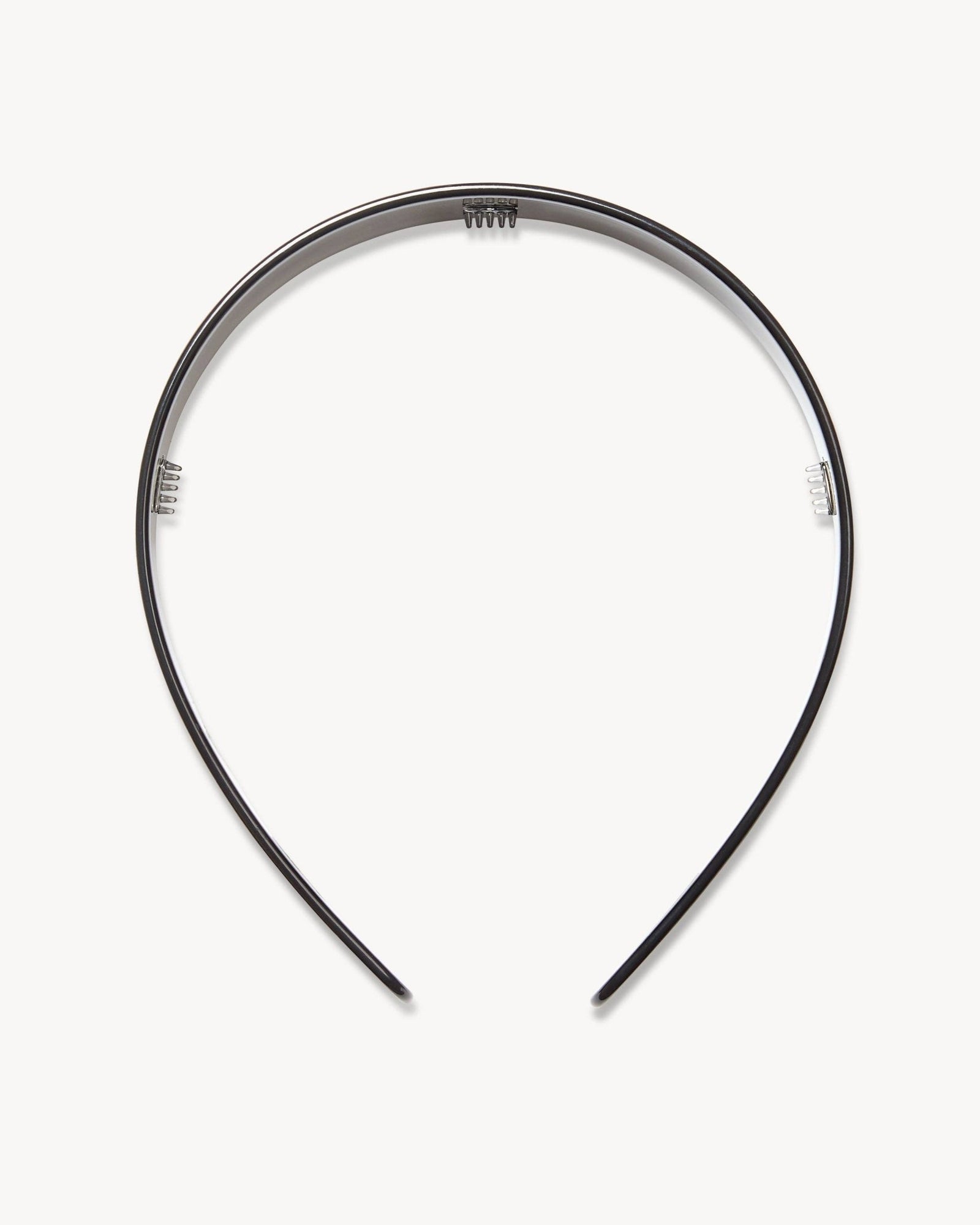 Machete's wide headband in black on a white surface.