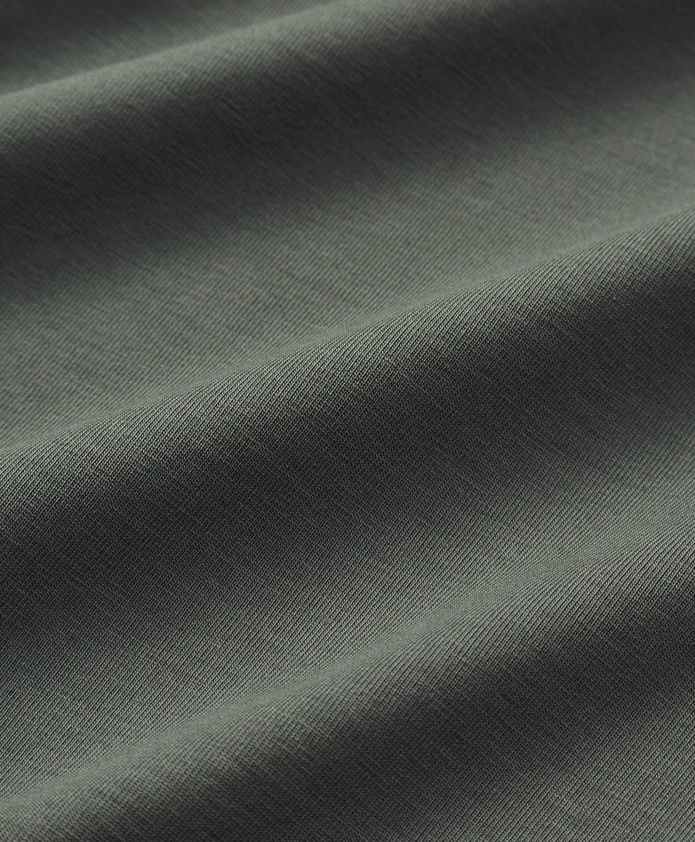 Close-up of castor green fabric with visible texture