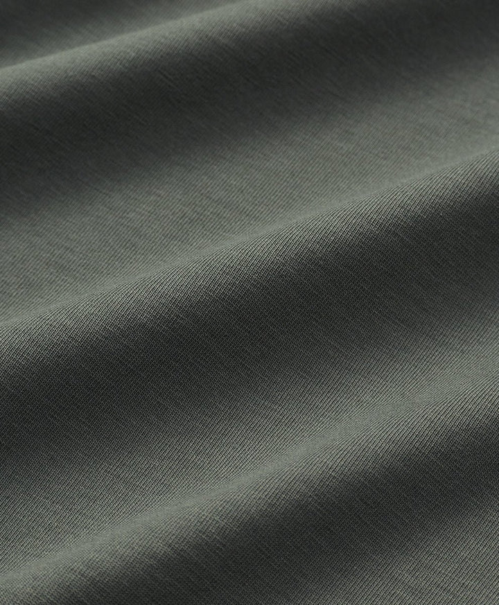 Close-up of castor green fabric with visible texture