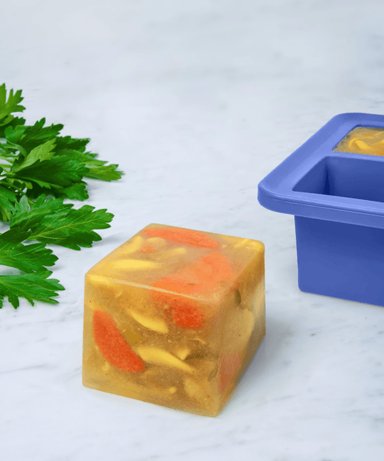 Cup Cube Silicone Food Meal Prep Storage Tray - Blue - Shown with frozen cube of soup - Echo Market