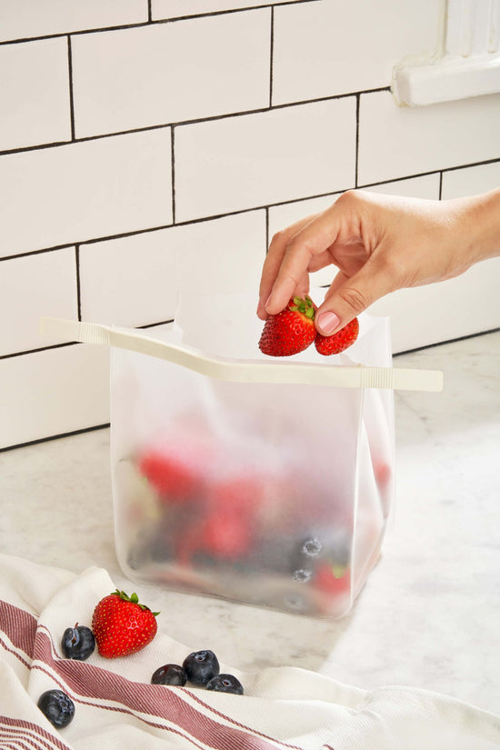 Roll Tight Storage Bag Set - One bag shown open and being filled with strawberries - Echo Market