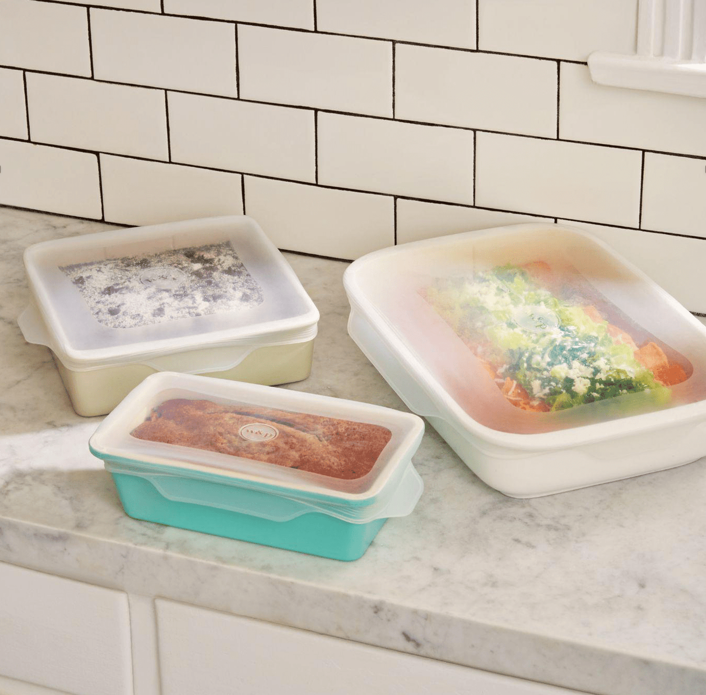 Silicone Stretch Baking Lids Set - Three different sizes shown covering pans of food - Echo Market