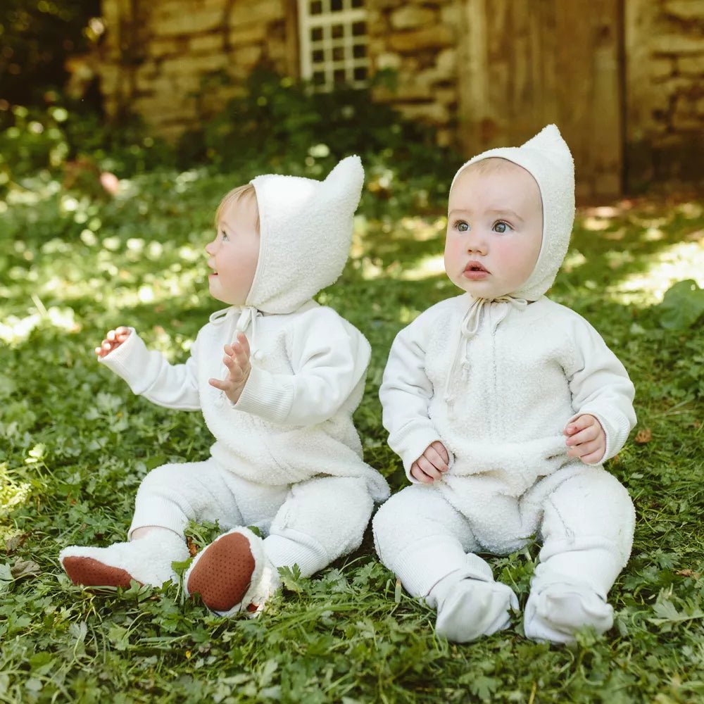 Sherpa Baby Stay-On Booties - Alabaster - Shown on baby model sitting outdoors - Echo Market